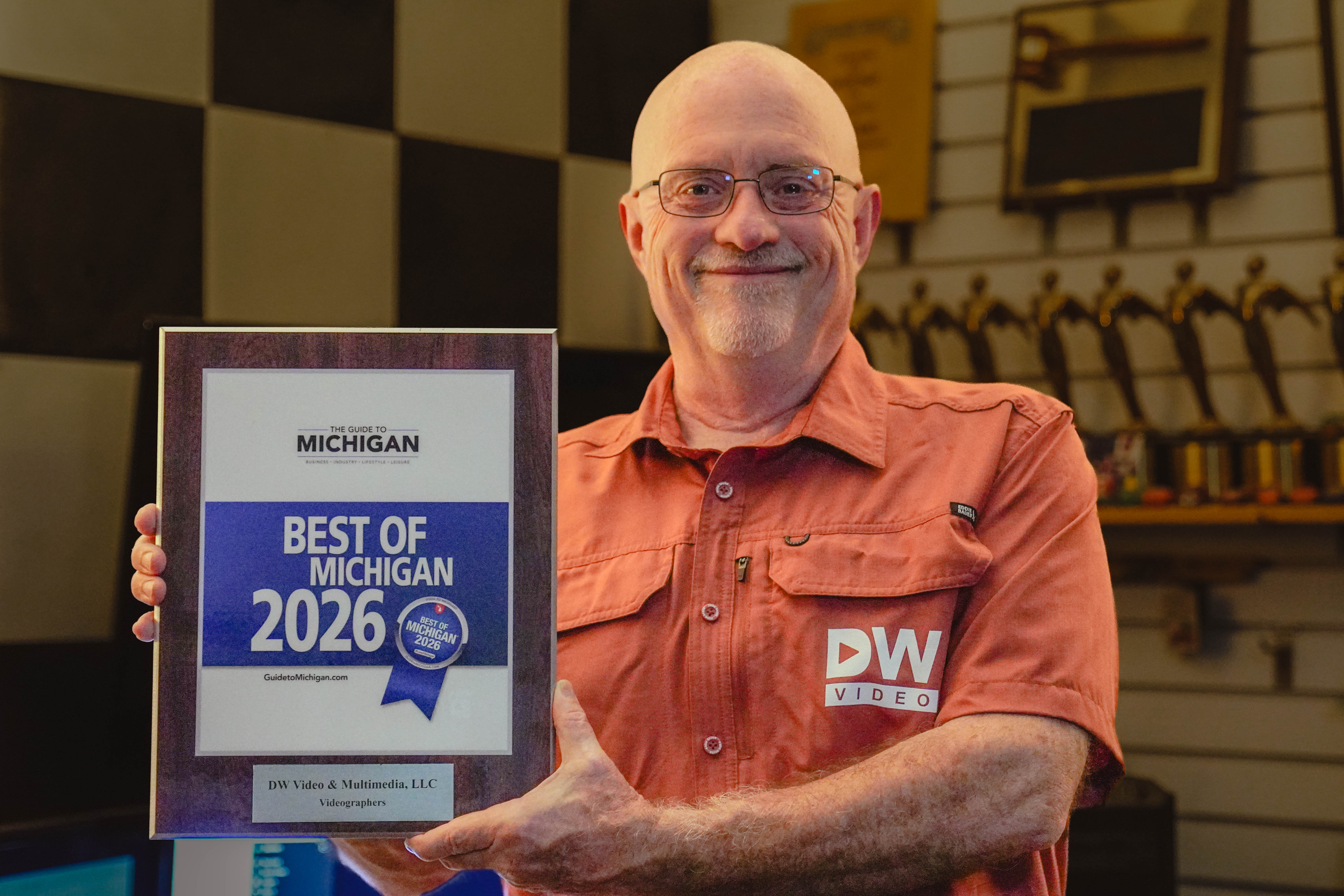 Duane Weed holding the 2026 Best of Michigan award for DW Video and Multimedia