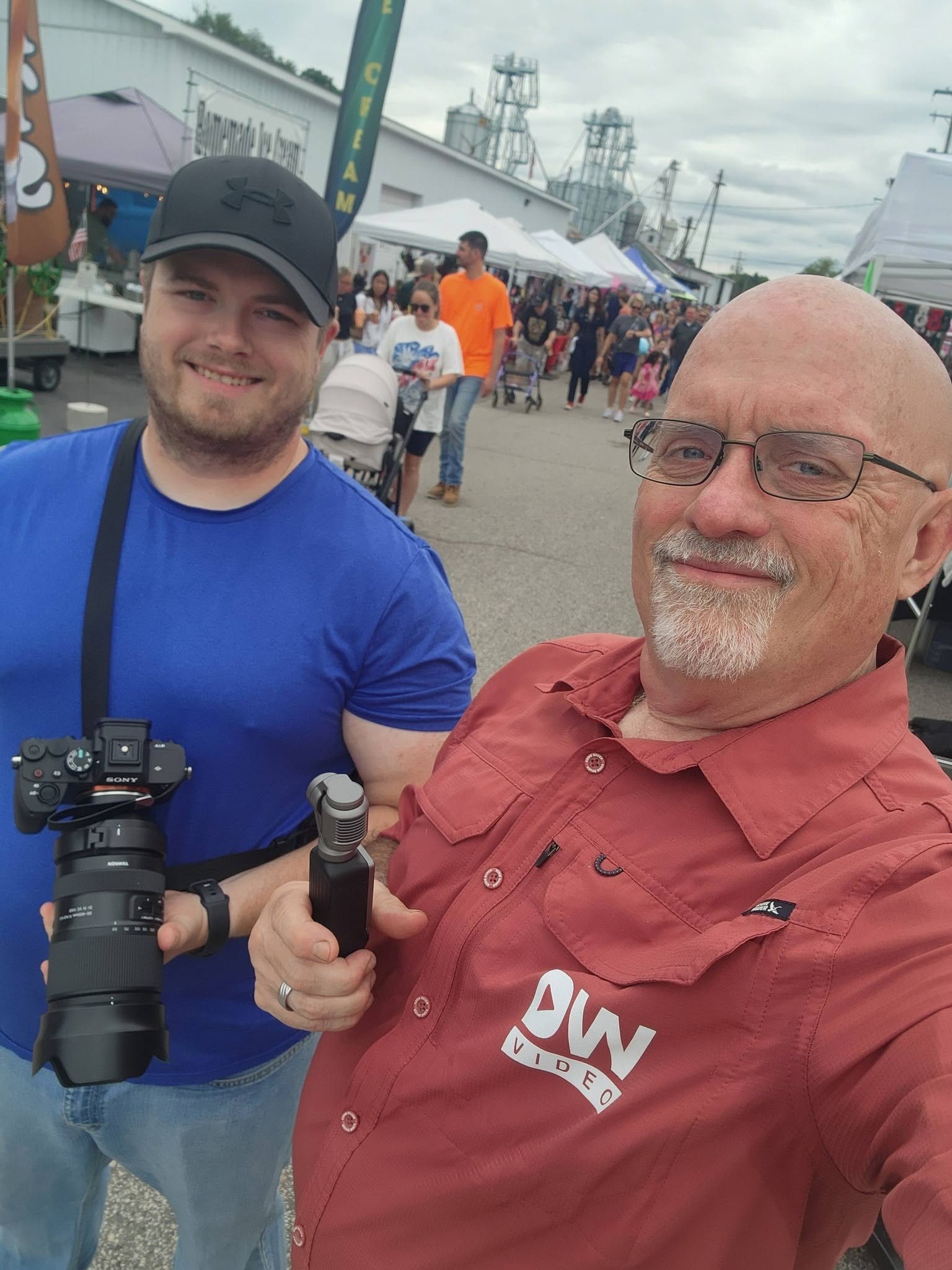 Duane Weed and Steven Rainwater with their cameras at a local event