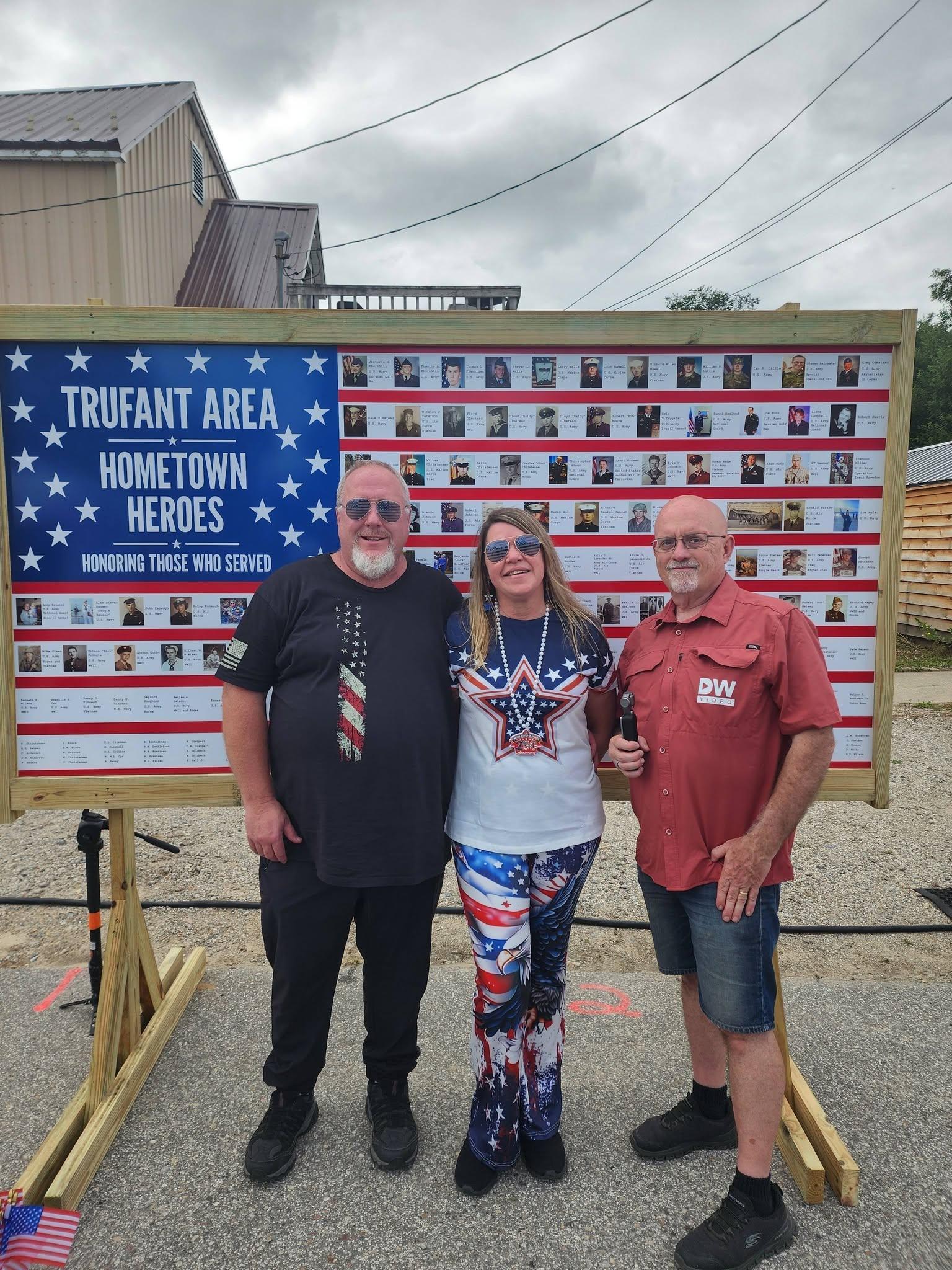 Duane Weed with community members beside the Trufant Area Hometown Heroes display