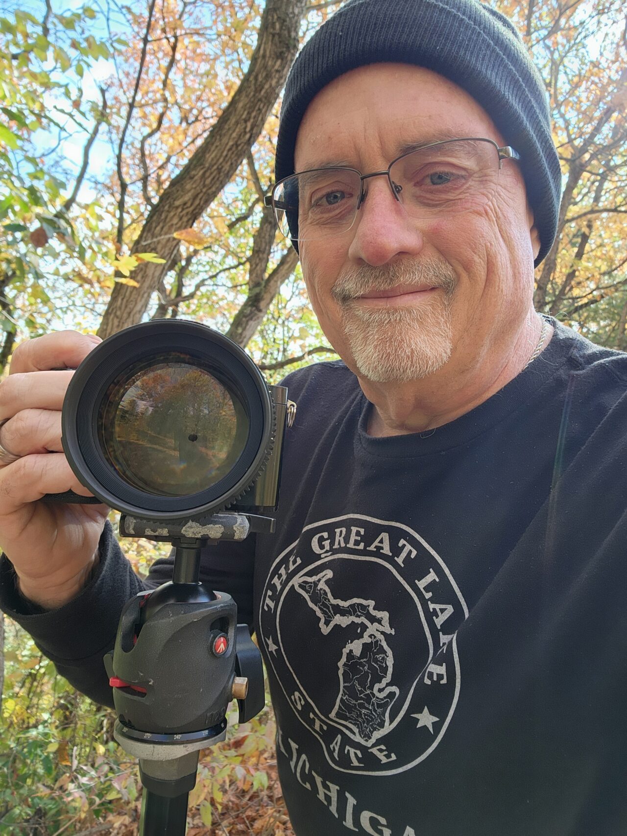 Content creator Duane Weed outdoors with his camera in Michigan